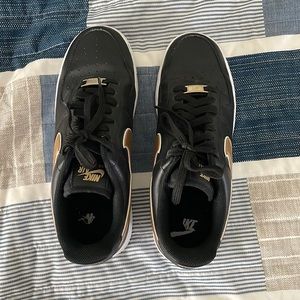 Black and gold Nike AF1